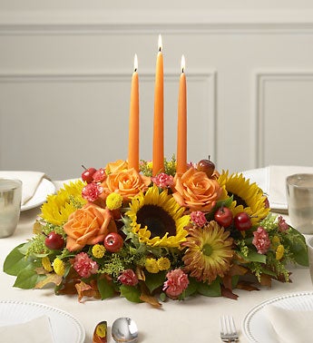 seasonal centerpiece with sunflowers, carnations
